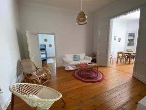 a living room with a couch and a table at La Casita in Arès