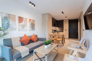 a living room with a couch and a table at Luxury Living 2BR Ideal for Families in Santiago