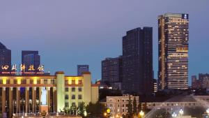a city skyline at night with tall buildings at The Ritz-Carlton, Chengdu in Chengdu