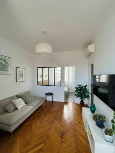a living room with a couch and a table at Exclusive Top Floor - Love Suite in Nice