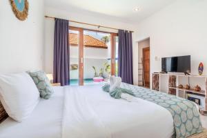 Private Suite in Tropical Pool Villa客房内的一张或多张床位