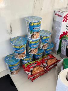 a pile of different types of food in a refrigerator at Just Like Home Bed & Spa Porsgrunn in Porsgrunn +37 photos