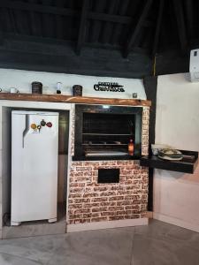 Kuchyň nebo kuchyňský kout v ubytování Chalé com Jacuzzi em Morretes