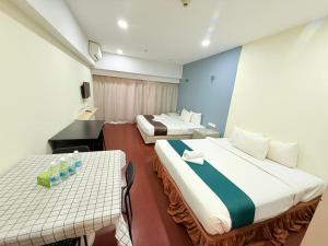 Postel nebo postele na pokoji v ubytování SUNVAY RESORT SUITe