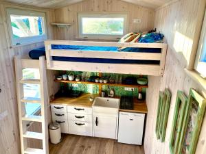 a small kitchen in a tiny house at Lavender Eco lodge át lake Balaton in Kisapáti +62 photos