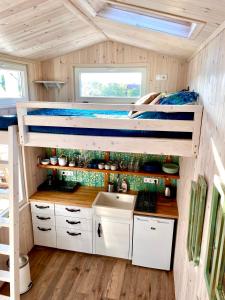 a bunk bed in a tiny house at Lavender Eco lodge át lake Balaton in Kisapáti