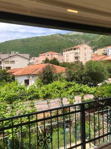 a view of a city from a balcony at Apartmani Centar in Petrovac na Moru