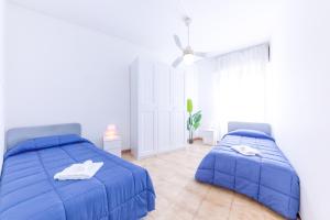 Ένα ή περισσότερα κρεβάτια σε δωμάτιο στο Portofino Relax - Close to the sea -Free Parking