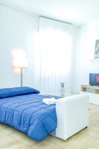 Ένα ή περισσότερα κρεβάτια σε δωμάτιο στο Portofino Relax - Close to the sea -Free Parking