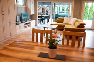 a living room with a couch and a table at Apartmán U Holoubka in Nové Město na Moravě