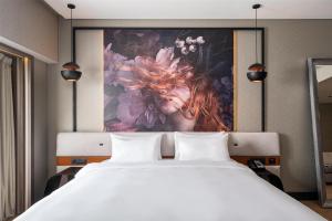 Ένα ή περισσότερα κρεβάτια σε δωμάτιο στο Radisson Blu Hotel Bucharest