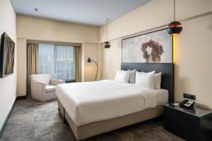 Ένα ή περισσότερα κρεβάτια σε δωμάτιο στο Radisson Blu Hotel Bucharest