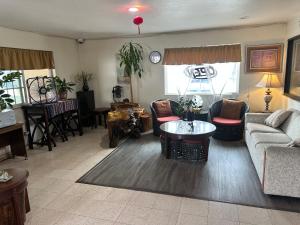 a living room with a couch and a table at Palm Inn Motel - Rosemead, Los Angeles in Rosemead