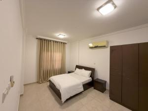 أجنحة هومينج ــ Homing Suites客房内的一张或多张床位
