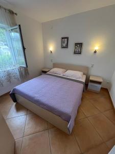 Postel nebo postele na pokoji v ubytování Apartmani Ana Juricev Vodice