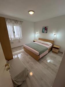 Postel nebo postele na pokoji v ubytování Apartmani Ana Juricev Vodice