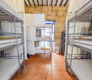 A kitchen or kitchenette at Ashavana Nest Hostel