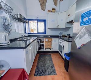 A kitchen or kitchenette at Ashavana Nest Hostel