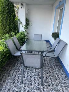 a table and chairs sitting on a patio at Dream House in Bălţi