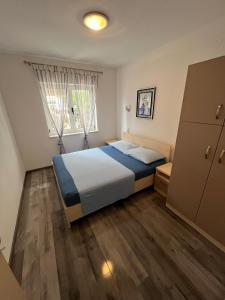 Postel nebo postele na pokoji v ubytování Apartmani Ana Juricev Vodice
