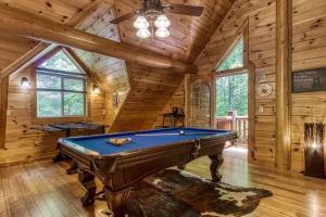 a room with a pool table in a cabin at The Lodge at Glades by Avada Properties in Gatlinburg +34 photos