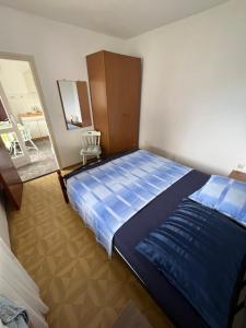 Postel nebo postele na pokoji v ubytování Apartmani Ana Juricev Vodice