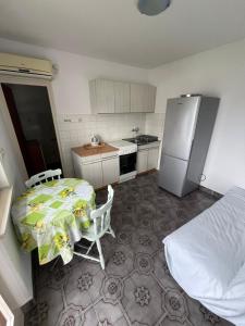 Kuchyň nebo kuchyňský kout v ubytování Apartmani Ana Juricev Vodice