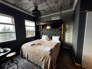 Postel nebo postele na pokoji v ubytování R13 - A Townhouse Hotel