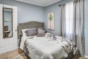 a bedroom with a bed and a window at Hampton Vacation Rental Central Location, Patio in Hampton