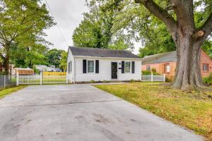 a white house with a white fence and a tree at Hampton Vacation Rental Central Location, Patio in Hampton
