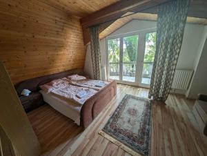 a bedroom with a bed in a wooden room at Holiday home in Gardony - Velence-See 20604 in Gárdony +38 photos