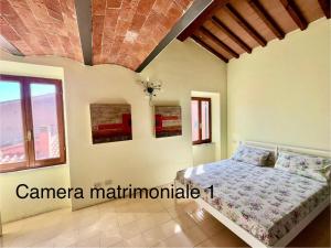 Postel nebo postele na pokoji v ubytování L'Antica Dimora - Elba Affitti