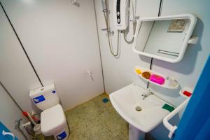 a hospital room with a sink and a toilet at Himalaya cabin in Nuwara Eliya +19 photos
