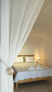 Postel nebo postele na pokoji v ubytování Cap Sounion Seafront Apartment - Adults Only