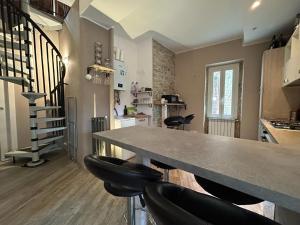 Kuchyň nebo kuchyňský kout v ubytování LINGUEIETTA Loft + 14 fotografií