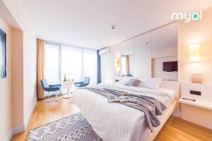 Voodi või voodid majutusasutuse MY SUNSHINE APARTMENTS BATuMI toas