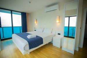 Voodi või voodid majutusasutuse MY SUNSHINE APARTMENTS BATuMI toas