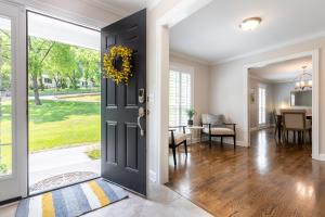 a door leading into a dining room with a table and a dining room at The Eloise by Stay Local Nashville in Nashville