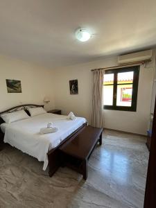 Postel nebo postele na pokoji v ubytování Magda Hotel Apartments