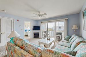 a living room with a couch and a table at Bethany Bay --- 1004 Pavilion Dr in Ocean View