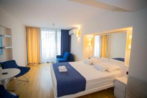 Voodi või voodid majutusasutuse MY SUNSHINE APARTMENTS BATuMI toas