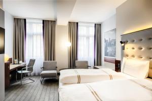 Postel nebo postele na pokoji v ubytování Premier Inn Köln City Mediapark