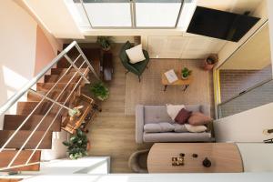 an overhead view of a living room with a couch at Private Terrace Duplex in El Poblado in Medellín