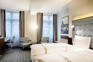 Postel nebo postele na pokoji v ubytování Premier Inn Köln City Mediapark