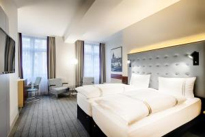 Postel nebo postele na pokoji v ubytování Premier Inn Köln City Mediapark