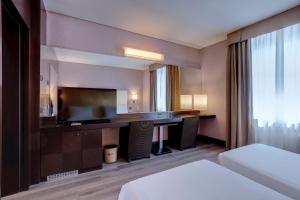 Postel nebo postele na pokoji v ubytování Hotel Nord