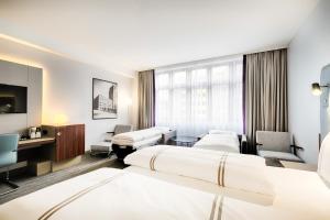 Postel nebo postele na pokoji v ubytování Premier Inn Köln City Mediapark