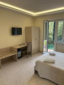 A television and/or entertainment centre at Vittorio Veneto Accomodation - Tropea city center