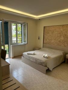 A bed or beds in a room at Vittorio Veneto Accomodation - Tropea city center