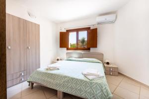 Ένα ή περισσότερα κρεβάτια σε δωμάτιο στο Villa Fico d'India n10